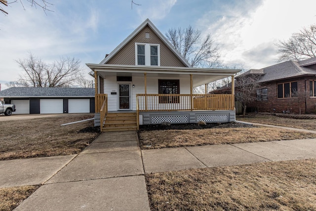 1503 Ottawa Ave, Ottawa, IL 61350 - view of front facade with a garage, a porch, and an outdoor structure