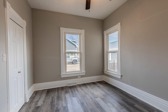 1503 Ottawa Ave, Ottawa, IL 61350 - unfurnished room featuring visible vents, ceiling fan, baseboards, and wood finished floors