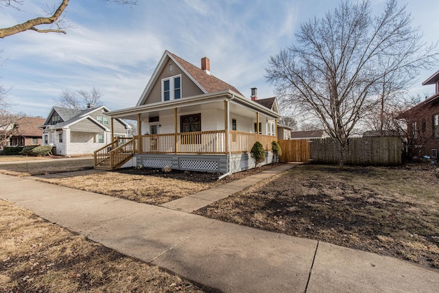 1503 Ottawa Ave, Ottawa, IL 61350 - view of front facade featuring a porch, a chimney, and fence