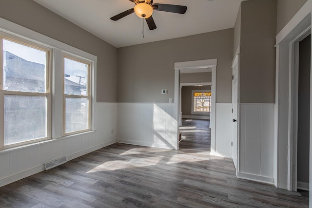 1503 Ottawa Ave, Ottawa, IL 61350 - empty room with plenty of natural light, wood finished floors, and visible vents