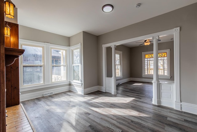 1503 Ottawa Ave, Ottawa, IL 61350 - interior space with decorative columns, visible vents, baseboards, ceiling fan, and wood finished floors