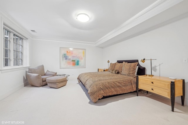 bedroom with carpet floors, visible vents, and ornamental molding