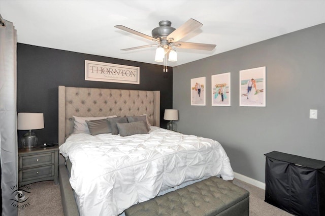 bedroom with ceiling fan, baseboards, and light colored carpet