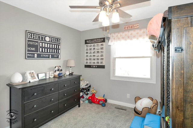 bedroom with a ceiling fan, carpet flooring, visible vents, and baseboards