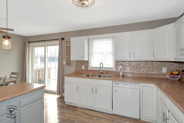 kitchen featuring a sink, white cabinetry, and dishwasher