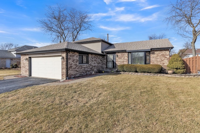 ranch-style home featuring driveway, brick siding, a garage, and a front yard