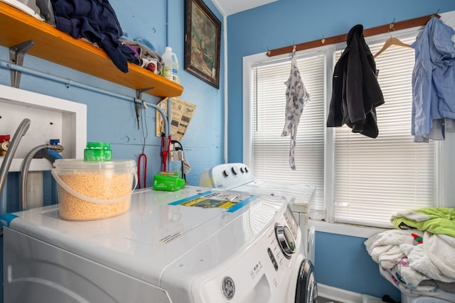 clothes washing area featuring laundry area and washing machine and dryer