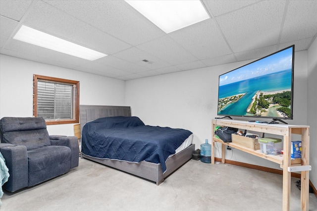 4461 N Il State Route 23, Leland, IL 60531 - bedroom featuring visible vents, a paneled ceiling, and concrete floors