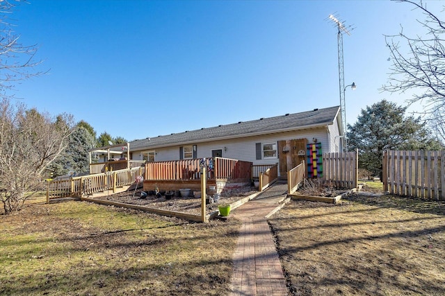 4461 N Il State Route 23, Leland, IL 60531 - rear view of house featuring a deck and fence