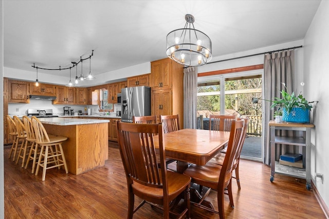 4461 N Il State Route 23, Leland, IL 60531 - dining area featuring dark wood finished floors and an inviting chandelier