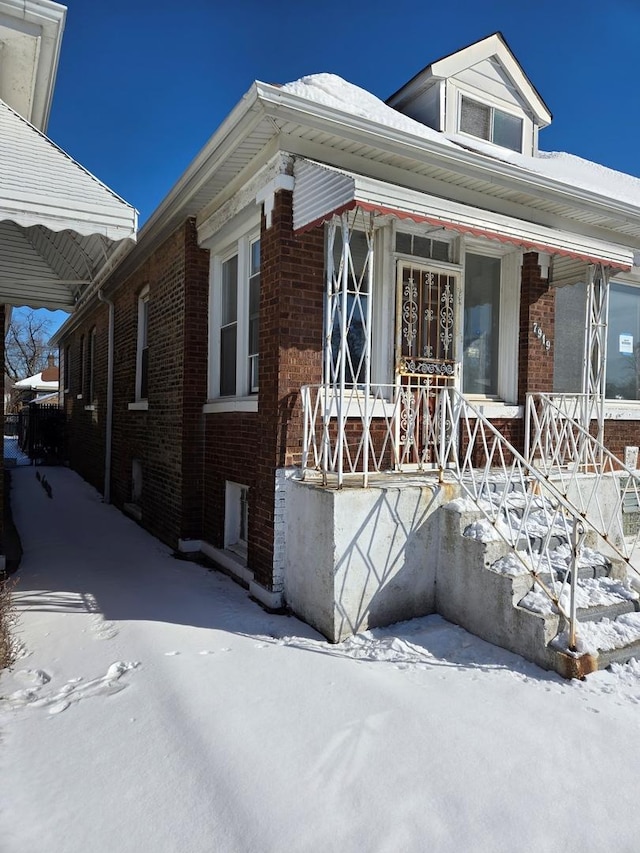 view of front of home featuring brick siding