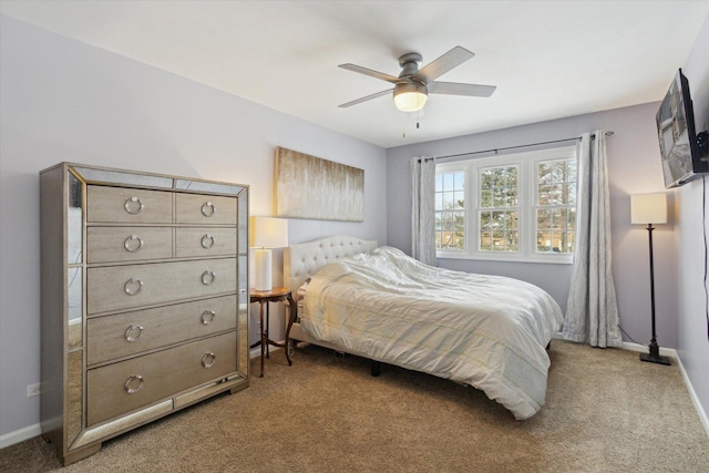 bedroom featuring baseboards, a ceiling fan, and light colored carpet