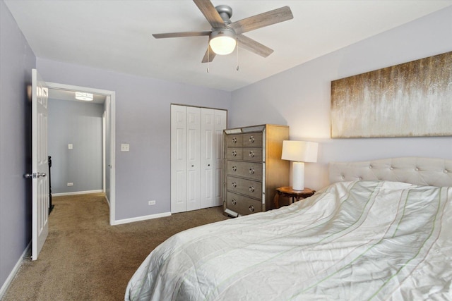 bedroom featuring a ceiling fan, dark colored carpet, a closet, and baseboards