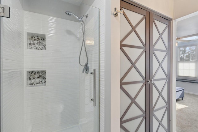 ensuite bathroom featuring a tile shower and ensuite bathroom