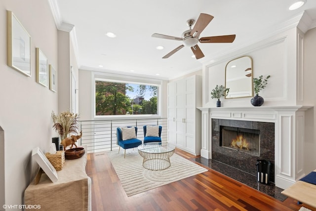 1418 W Chestnut St Unit 1, Chicago, IL 60642 - sitting room featuring ornamental molding, wood finished floors, a tiled fireplace, ceiling fan, and recessed lighting