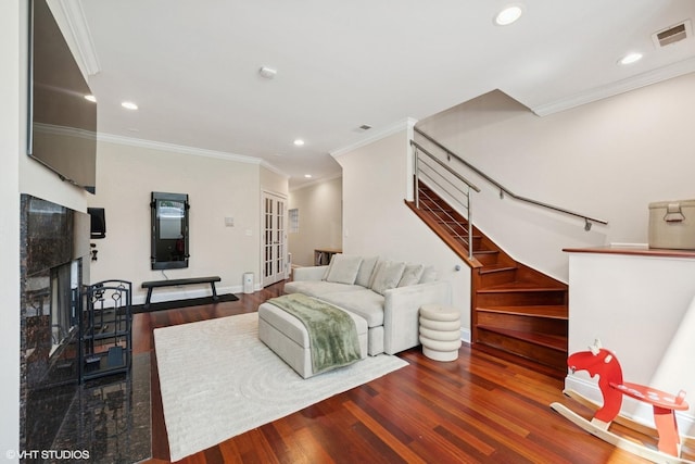 1418 W Chestnut St Unit 1, Chicago, IL 60642 - living area featuring stairs, wood finished floors, crown molding, recessed lighting, and a fireplace with raised hearth