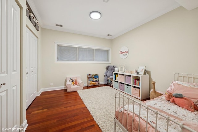 1418 W Chestnut St Unit 1, Chicago, IL 60642 - bedroom with wood finished floors, crown molding, and a closet