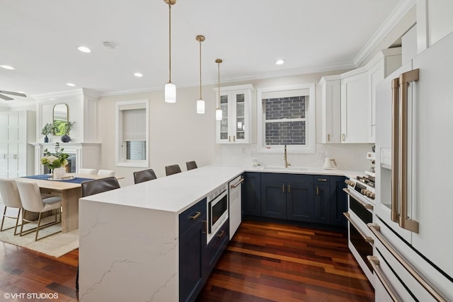 1418 W Chestnut St Unit 1, Chicago, IL 60642 - kitchen with white appliances, a peninsula, dark wood-type flooring, ornamental molding, and white cabinetry
