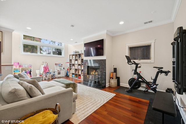 1418 W Chestnut St Unit 1, Chicago, IL 60642 - living room featuring wood finished floors, a tile fireplace, ornamental molding, and recessed lighting