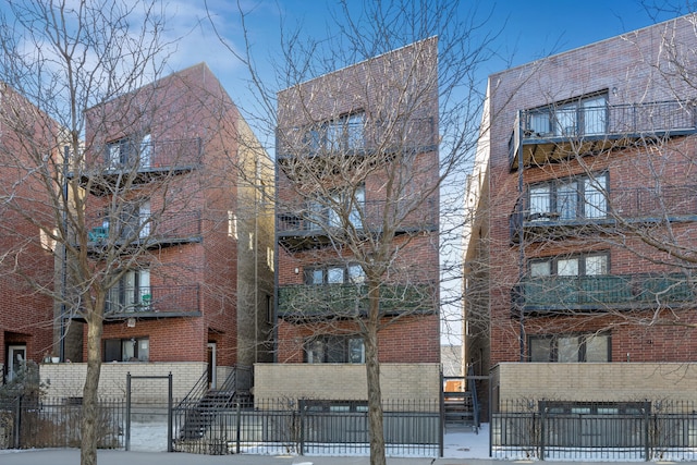 view of building exterior with a fenced front yard