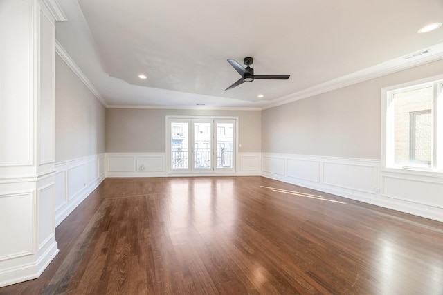 spare room featuring dark wood finished floors, recessed lighting, visible vents, a ceiling fan, and ornamental molding