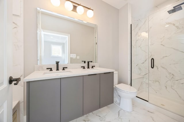 full bathroom with toilet, marble finish floor, a marble finish shower, and a sink