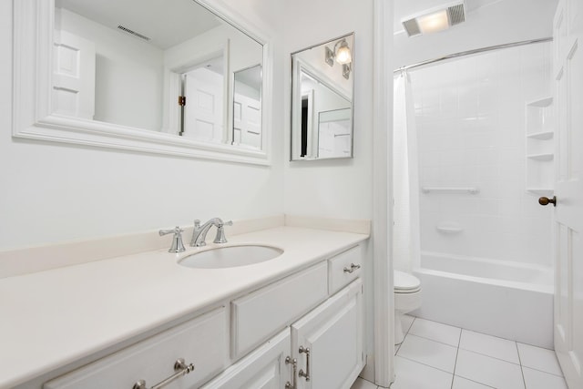 full bath featuring toilet, vanity, visible vents, and tile patterned floors