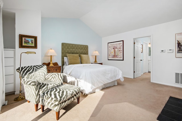 bedroom featuring vaulted ceiling, baseboards, visible vents, and light colored carpet