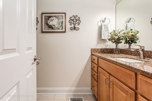 bathroom with tile patterned flooring, visible vents, vanity, and baseboards