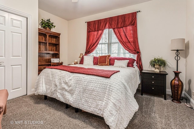 carpeted bedroom with baseboards