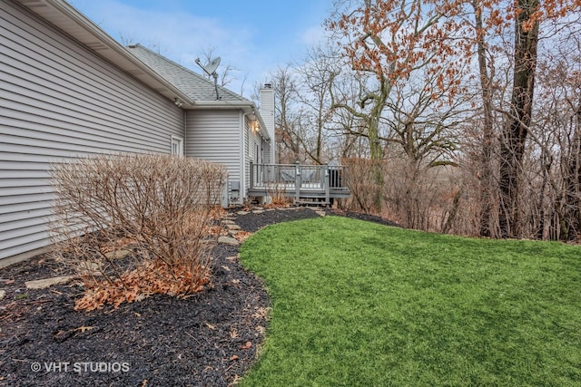 view of yard with a wooden deck