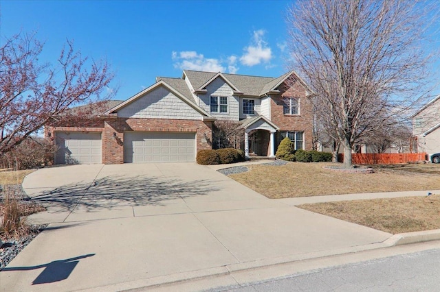 view of front of property featuring concrete driveway, brick siding, an attached garage, and fence