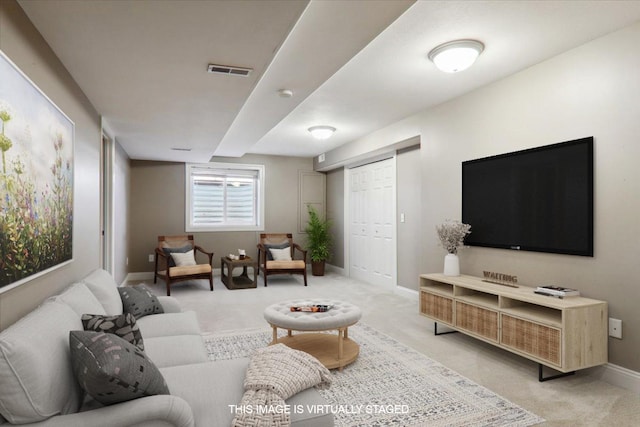 living area featuring carpet, visible vents, and baseboards