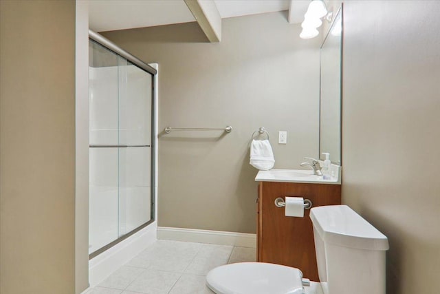 full bathroom featuring baseboards, toilet, tile patterned flooring, vanity, and a shower stall