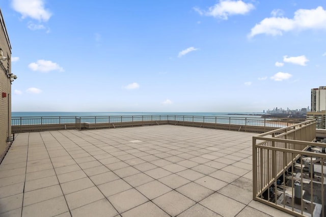 view of patio with a water view