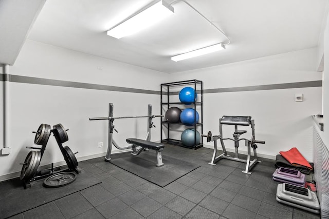 exercise room with baseboards