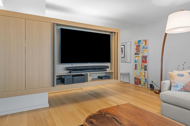 unfurnished living room with wood finished floors