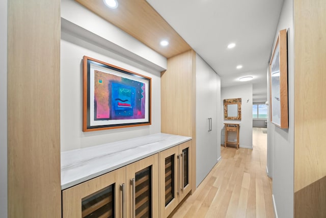 hall with light wood-type flooring and recessed lighting