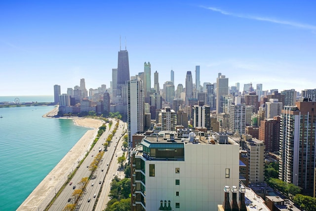 view of city with a view of the beach and a water view