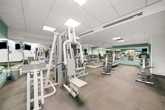 workout area with a drop ceiling