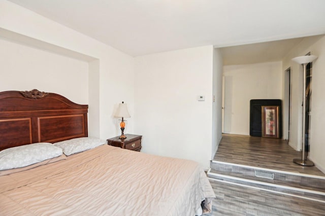 bedroom with wood finished floors