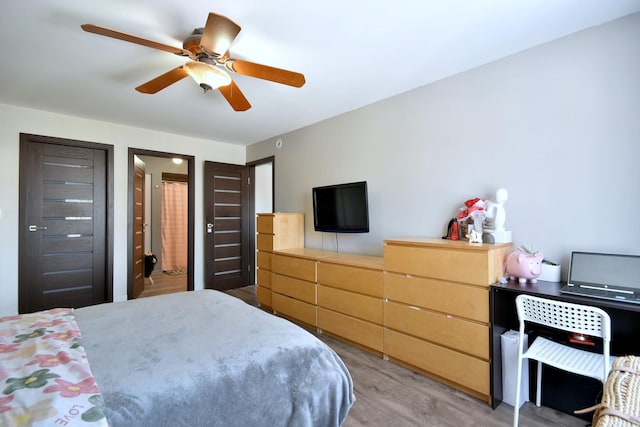 bedroom featuring wood finished floors and a ceiling fan