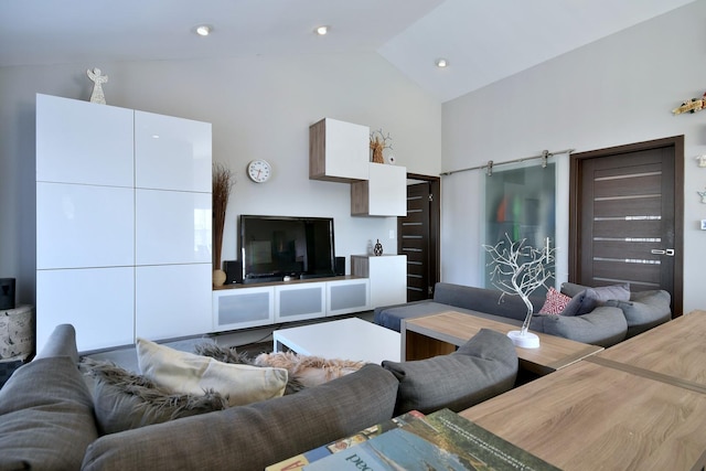 living room featuring lofted ceiling and recessed lighting