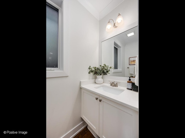 bathroom with vanity and baseboards