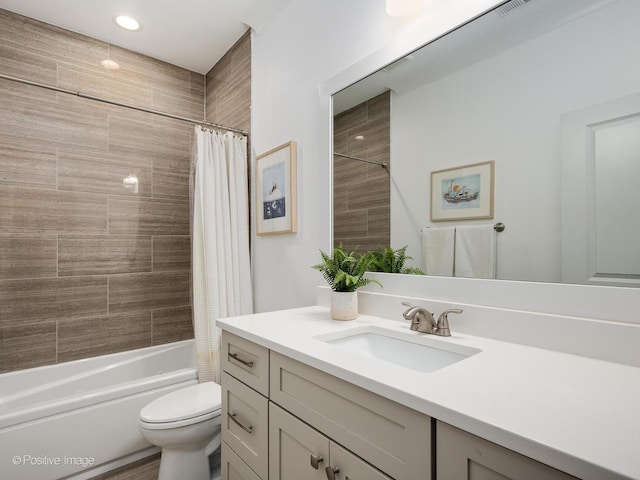 bathroom featuring shower / bath combination with curtain, vanity, and toilet