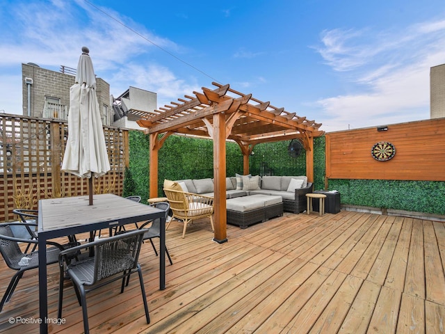 wooden terrace with outdoor dining area, a pergola, and an outdoor hangout area