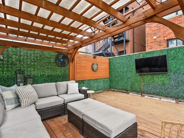 deck featuring an outdoor hangout area and a pergola