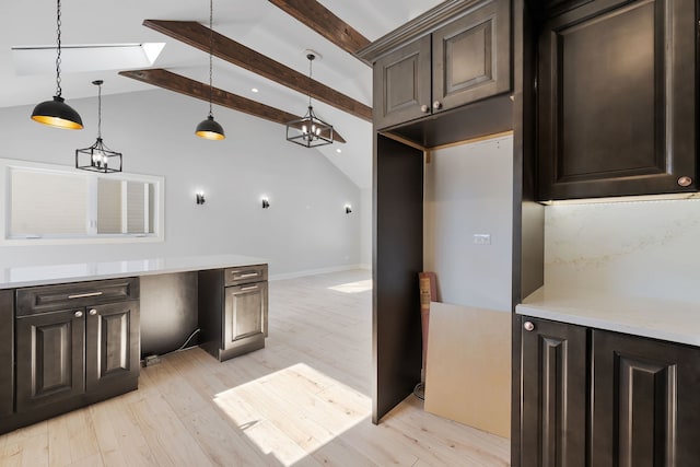 kitchen featuring vaulted ceiling with beams, light wood-style flooring, decorative light fixtures, and dark brown cabinetry