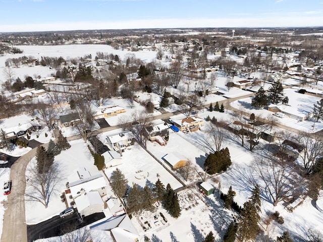 snowy aerial view featuring a residential view