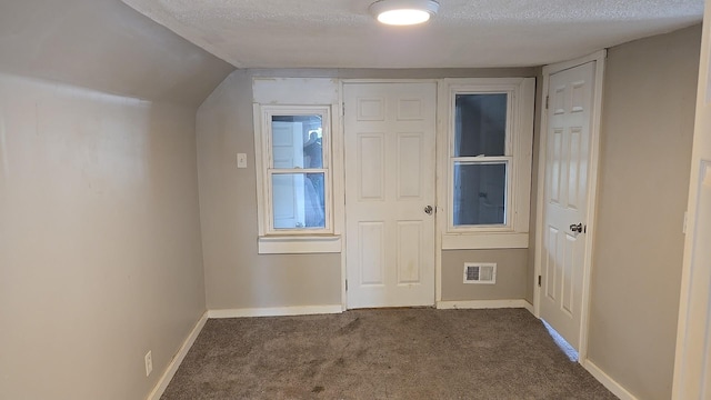 41 E 100th Pl, Chicago, IL 60628 - unfurnished bedroom featuring carpet flooring and a textured ceiling